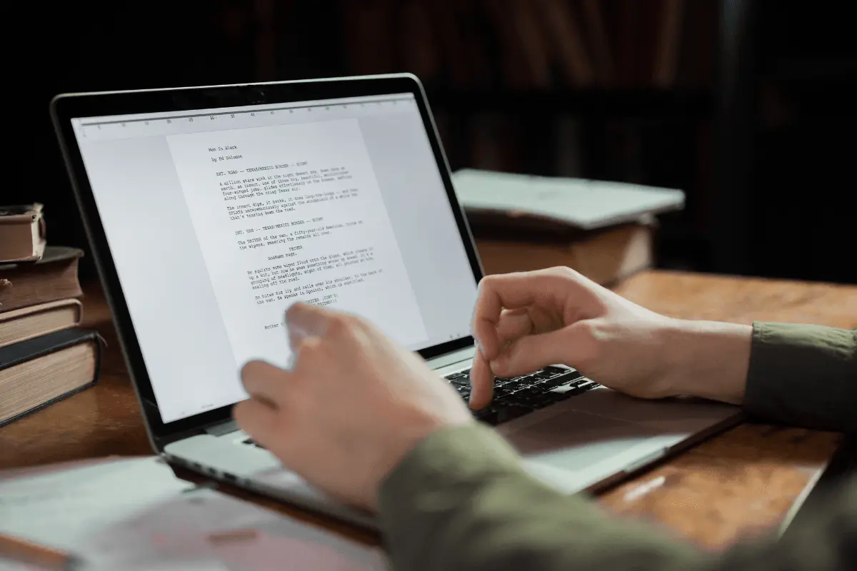 A person typing on a laptop.