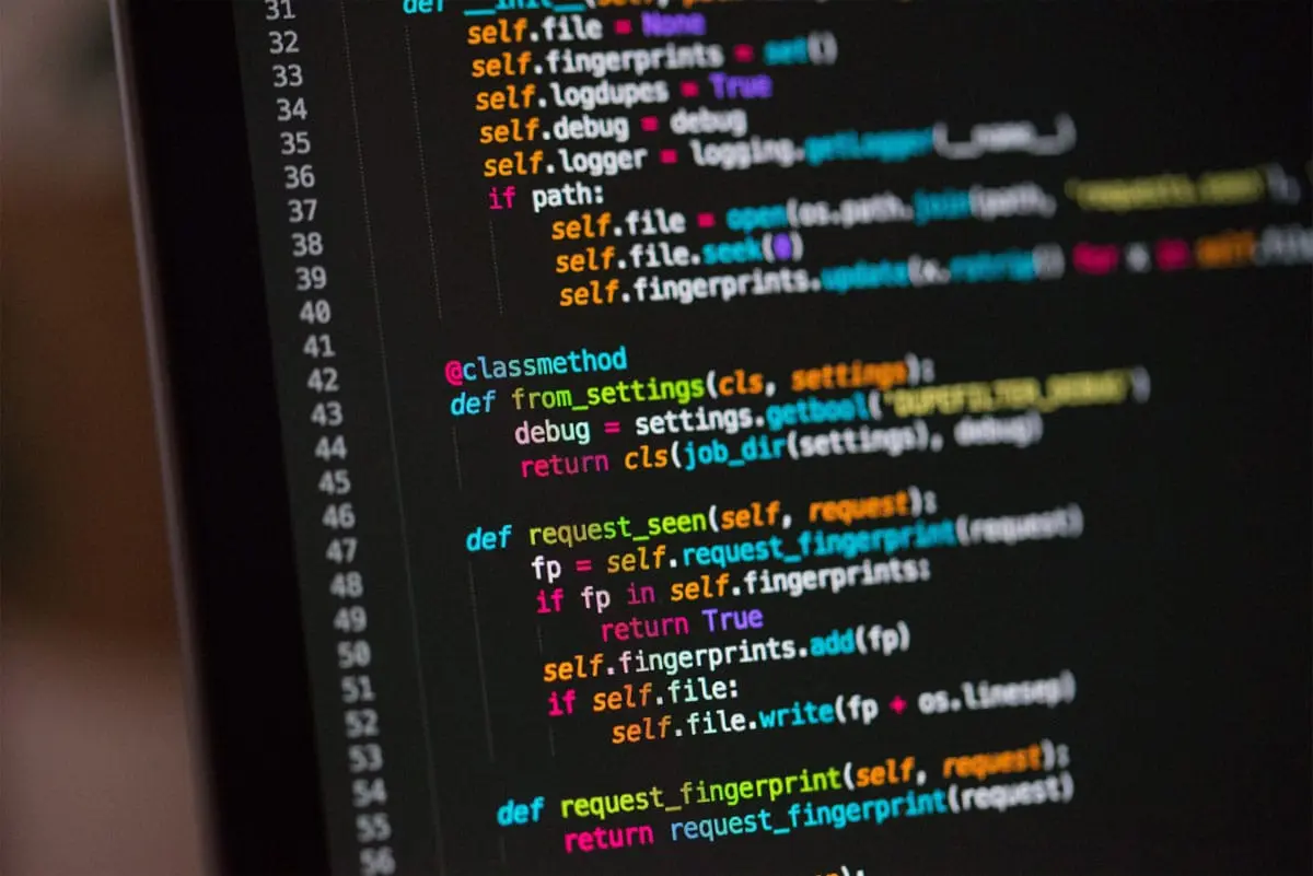 Close-up of colorful Python code on a computer screen, showing functions and syntax for debugging