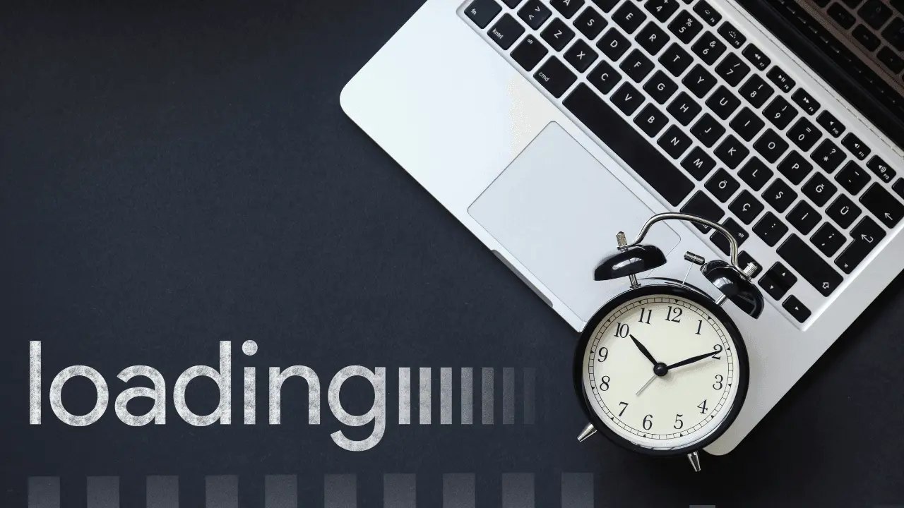 A laptop and clock
